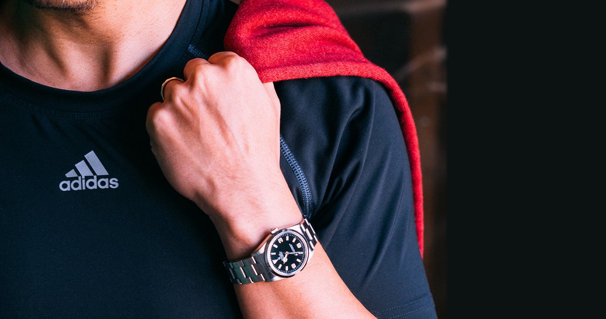 Man wearing a Rolex watch at the gym