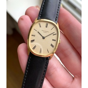 Vintage Patek Philippe 18K Yellow Gold Tank Manual Wind Champagne Roman Dial Wat Patek Philippe Buy at TrueFacet